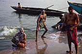 The rite of washing in the Ganges river at dusk, after a day of hard work. 