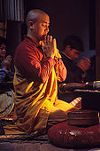 Evening prayer in a Buddhist monastery in the Varanasi's neighborhood of Sarnath, where the Buddha once started his predication.