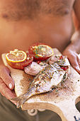 Balkan, Adriatic sea coast    Republic of Montenegro    near Budva Pic nic     on the beach 'Kajanegra'    grilled fish        