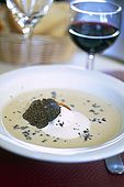 France, Lot, Quercy region village Lalbenque marché du mardi restaurant 'le Café du Monde' chef Gilles Marre du restaurant Le Balandre soupe d'artichaud à la truffe et crème fraiche editorial only