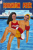 Couple posing behind the tradition picture board on Brighton Pier