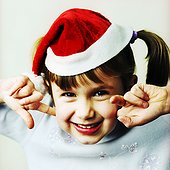 A girl wearing a Santa hat