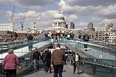 England, London, South Bank. A view across the Millennium Bridge to St Paul's Cathedral.