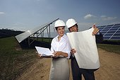 engineers working on solar panel