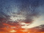 Beautiful sunset cloudscape scene. Abstract clouds texture, celestial beauty. Nebula dusk view