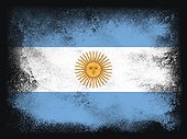 Argentina Flag design composition of exploding powder and paint, isolated on a black background for copy space. Colorful abstract dust particles explosion. World cup 2022 football symbol for printing