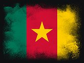 Cameroon Flag design composition of exploding powder and paint, isolated on a black background for copy space. Colorful abstract dust particles explosion. World cup 2022 football symbol for printing