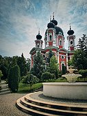 Curchi Monastery outdoor view of the famous landmark in Orhei, Moldova. Christian Orthodox style church tradional for eastern Europe culture. Beautiful garden with trees around the basilica