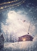 Magical holiday scene and Santa Claus sleigh with reindeers flying above the snowy house in the Christmas Eve. Wonderful snowflakes covering the village, and the full moon comes out of the clouds
