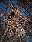 Eiffel Tower architecture details Paris, France. Underneath the metallic structure, steel elements with different geometric shapes