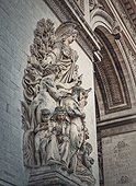 Closeup architectural details of the triumphal Arch, Paris, France. The peace statue (La Paix de 1815) adorns a pillar of the Arc de Triomphe with goddess of victory Minerva