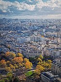 Paris cityscape vertical view from the Eiffel tower height, France. Fall season scene with colored trees