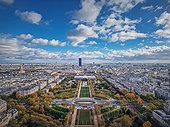 Paris cityscape view from the Eiffel tower heights, France. Montparnasse tower and Les Invalides seen on the horizon panorama. Beautiful autumn colors