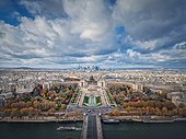 Aerial panoramic view from the Eiffel tower height to the Paris cityscape, France. Seine river, Trocadero area and La Defense metropolitan district seen on the horizon