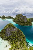 A view from on top of the small islets of the natural protected harbor in Wayag Bay, Raja Ampat, Indonesia, Southeast Asia, Asia