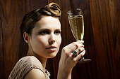Young woman holding champagne flute