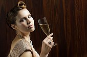 Young woman with glass of champagne, portrait