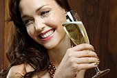 Young woman holding champagne flute
