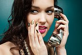 Young woman using vintage telephone