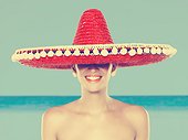 Young woman wearing red sombrero