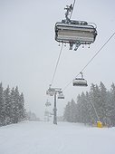 Ski lift in snowfall
