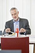 Businessman having lunch in the office
