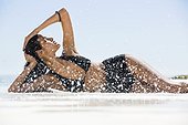 Beautiful woman in bikini posing on the beach