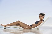 Beautiful woman sunbathing on the beach