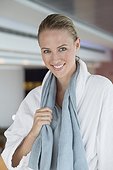 Portrait of a smiling woman in bathrobe at spa