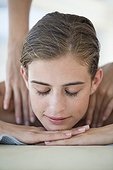 Woman receiving back massage from a massage therapist