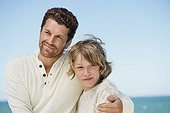 Man with his son on the beach