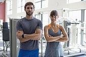 Portrait of a young couple standing in health club
