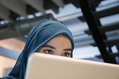 Arab businesswoman using a laptop