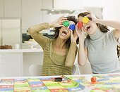 Women having fun with board game