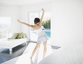 Woman stretching in living room