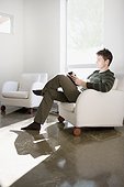 Man reading on modern living room