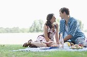 Couple having picnic in park
