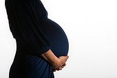 Woman holding her pregnant stomach