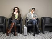 Two businesswomen sitting in waiting room. Brussels, Belgium.