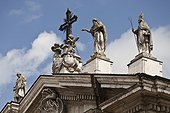 Ornate statues on roof of building