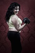 Woman lifting weights at home
