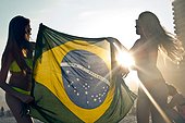 *** IMAGE REMOVED *** Two young women with Brazilian Flag in sunlight