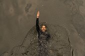 Overhead view of man wild swimming in river