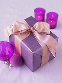 Christmas gift wrapped in a pink ribbon