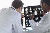 Doctors analyzing medical records