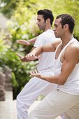 Two men practicing yoga