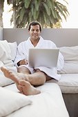 Man using laptop in health spa