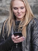 Blonde woman using cell phone