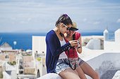 Teenage friends (16-17) taking pictures, Greece
