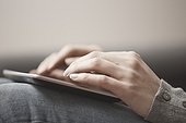 Hands of woman using tablet computer